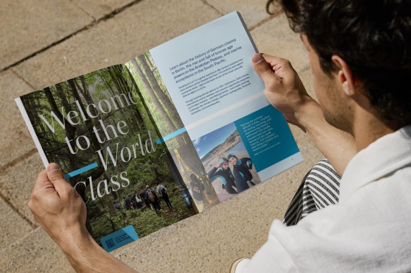 Reader holding open the U of T viewbook